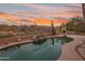 Beautiful backyard pool area featuring desert landscaping and a serene setting with a mountain view at 4413 S Tigre Del Mar Dr, Gold Canyon, AZ 85118