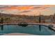 Backyard pool and patio, featuring desert landscaping and a relaxing view at 4413 S Tigre Del Mar Dr, Gold Canyon, AZ 85118
