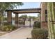 The pool area entrance includes a pergola, mature landscaping, and privacy fencing at 4413 S Tigre Del Mar Dr, Gold Canyon, AZ 85118