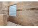 Contemporary shower featuring decorative tile and glass block window at 4413 S Tigre Del Mar Dr, Gold Canyon, AZ 85118
