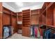 Spacious walk-in closet with custom shelving, drawers, and ample hanging space for organized storage at 4413 S Tigre Del Mar Dr, Gold Canyon, AZ 85118