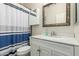 Bathroom featuring a vanity, mirror, and shower with a stylish blue striped curtain at 4630 E Mountain Vista Dr, Phoenix, AZ 85048