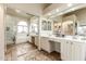 Bright bathroom with double sinks, vanity space, and a separate tub and shower at 4630 E Mountain Vista Dr, Phoenix, AZ 85048