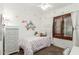 Bright bedroom with whimsical polka dot accents, a dresser, and light filtering shutters at 4630 E Mountain Vista Dr, Phoenix, AZ 85048