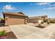 Suburban house featuring a spacious two-car garage and xeriscaped front yard at 4630 E Mountain Vista Dr, Phoenix, AZ 85048