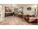 Inviting living room featuring travertine floors and a classic piano at 4630 E Mountain Vista Dr, Phoenix, AZ 85048