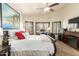 Bedroom with a king bed, shutters, and a view of the fireplace and TV at 4630 E Mountain Vista Dr, Phoenix, AZ 85048
