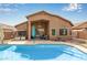 Inviting backyard pool featuring a covered patio, lush landscaping, and ample space for outdoor entertaining at 4630 E Mountain Vista Dr, Phoenix, AZ 85048
