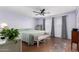 Spacious main bedroom boasts a ceiling fan, neutral walls, and generous natural light at 4838 E Calypso Ave, Mesa, AZ 85206
