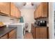 Functional laundry area featuring ample cabinet space and modern washer and dryer at 4838 E Calypso Ave, Mesa, AZ 85206
