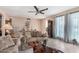 Inviting living room with tiled flooring, neutral paint, and comfortable seating at 4838 E Calypso Ave, Mesa, AZ 85206
