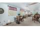 Spacious living room with neutral carpet, ceiling fans, and lots of natural light at 4838 E Calypso Ave, Mesa, AZ 85206