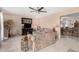 Inviting living room with tiled flooring, neutral paint, and comfortable seating at 4838 E Calypso Ave, Mesa, AZ 85206