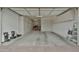 Spacious garage with ample storage cabinets for organizing tools, equipment and an electric vehicle charger at 5195 N 207Th Dr, Buckeye, AZ 85396