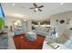 Spacious open-concept living room showcasing seamless flow to the dining and kitchen areas at 5195 N 207Th Dr, Buckeye, AZ 85396