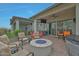 Outdoor patio with seating area, fire pit, TV, built in BBQ and Hot Tub for entertaining or enjoying the fresh air at 5195 N 207Th Dr, Buckeye, AZ 85396