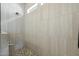 This tiled walk-in shower features a built-in bench, offering style and relaxation at 5195 N 207Th Dr, Buckeye, AZ 85396