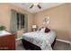 Welcoming bedroom featuring comfortable bed, and natural light from a window at 520 S 196Th Dr, Buckeye, AZ 85326