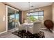 Breakfast nook with sliding glass doors that lead to backyard pool with mountain views at 520 S 196Th Dr, Buckeye, AZ 85326