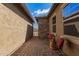 Cozy outdoor sitting area between the house and courtyard, with a table and chairs at 520 S 196Th Dr, Buckeye, AZ 85326