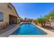 Beautiful pool area features patio seating, desert landscaping, blue sky and plenty of space at 520 S 196Th Dr, Buckeye, AZ 85326