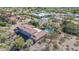 Aerial view of a desert home with a tile roof, pool, privacy landscaping and mountain views at 6340 N 34Th Pl, Paradise Valley, AZ 85253