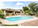 Beautiful backyard features a private pool, lush landscaping, and spacious patio at 6340 N 34Th Pl, Paradise Valley, AZ 85253