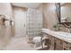 Well-appointed bathroom with glass block shower and marble countertop at 6340 N 34Th Pl, Paradise Valley, AZ 85253