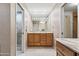 Bathroom featuring a vanity, built-in cabinets, and a glass enclosed shower at 6340 N 34Th Pl, Paradise Valley, AZ 85253