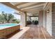 Covered patio showcasing brick pillars, tiled floor, and a view of the pool at 6340 N 34Th Pl, Paradise Valley, AZ 85253