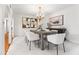 Bright and airy dining room featuring modern furniture and a stylish chandelier at 6340 N 34Th Pl, Paradise Valley, AZ 85253