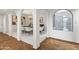 Open dining room with elegant archways, modern chandelier, and contemporary decor at 6340 N 34Th Pl, Paradise Valley, AZ 85253