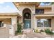 Charming home featuring a stone and brick entrance with a beautiful arched doorway at 6340 N 34Th Pl, Paradise Valley, AZ 85253