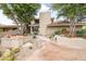 Elegant home featuring a brick facade, lush landscaping, and a brick walkway leading to the entrance at 6340 N 34Th Pl, Paradise Valley, AZ 85253