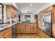 Kitchen featuring stainless steel appliances, wood cabinets, and granite countertops at 6340 N 34Th Pl, Paradise Valley, AZ 85253