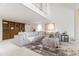 Large living room area with built-in shelving, large sectional sofa, and open, lofted ceilings at 6340 N 34Th Pl, Paradise Valley, AZ 85253