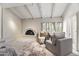 Cozy living area with a brick fireplace, exposed beam ceiling, and comfortable seating at 6340 N 34Th Pl, Paradise Valley, AZ 85253