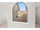 Arched window offering picturesque views of the surrounding desert landscape at 6340 N 34Th Pl, Paradise Valley, AZ 85253