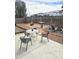 Backyard featuring a stone patio, outdoor seating, and rock landscaping at 6527 W Adams St, Phoenix, AZ 85043
