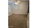 Cozy bedroom featuring carpeted floors, neutral walls, and natural lighting at 6527 W Adams St, Phoenix, AZ 85043