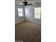 Bedroom featuring carpeted floors, neutral walls, and natural lighting at 6527 W Adams St, Phoenix, AZ 85043
