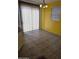 Dining area with neutral walls, tile floors, and sliding door at 6527 W Adams St, Phoenix, AZ 85043