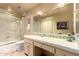 Well-lit bathroom featuring a shower with sliding glass door and a vanity with storage drawers at 6701 N Scottsdale Rd # 15, Scottsdale, AZ 85250