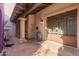 Picturesque front entry with shade, stone columns, brick pavers, and an ornate wrought iron gate at 6701 N Scottsdale Rd # 15, Scottsdale, AZ 85250