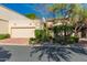 Charming home featuring a two-car garage, desert landscaping, and lovely curb appeal on a sunny day at 6701 N Scottsdale Rd # 15, Scottsdale, AZ 85250