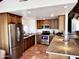 Well-lit kitchen featuring stainless steel appliances and granite countertops at 6701 N Scottsdale Rd # 15, Scottsdale, AZ 85250