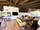 Comfortable living room with sofas, terracotta floors, and beamed ceilings at 6701 N Scottsdale Rd # 15, Scottsdale, AZ 85250