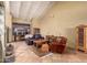 Spacious living area with comfortable seating, beam ceilings, and tile floors, perfect for relaxation at 6701 N Scottsdale Rd # 15, Scottsdale, AZ 85250