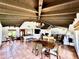 Spacious living space boasts terracotta floors, beamed ceilings, and seamless flow at 6701 N Scottsdale Rd # 15, Scottsdale, AZ 85250