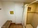 Shower room with tiled walls, tiled floor, and bench at 6701 N Scottsdale Rd # 15, Scottsdale, AZ 85250